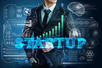 Inscription start-up, businessman in suit image of development strategy charts, business concept. New technologies. Copy space.