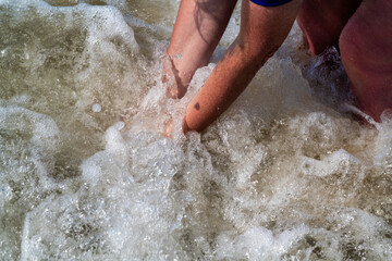 Fototapeta premium woman having fun in the sea with a lot of splashes