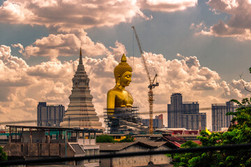 Close-up natural background of the waterfront community, a large Buddha statue (Wat Paknam Phasi Charoen) stands beautifully, seen in tourist attractions in Bangkok, Thailand.