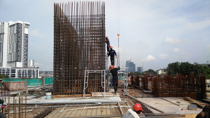 KUALA LUMPUR, MALAYSIA -AUGUST 23, 2019: Construction workers working at the construction site in...