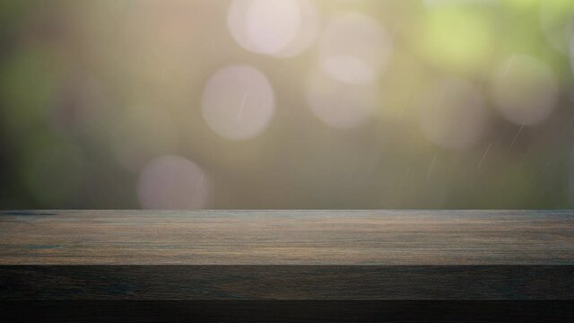 Wood table bar and nature tree bokeh blurred background, Top wood table space area for products shows. 3840x2160. 4K UHD. Video Clip.