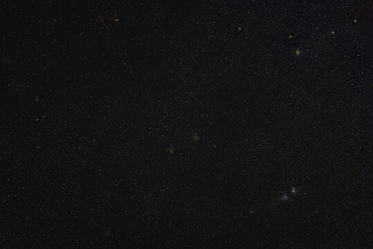 Night sky, many stars with some deep space objects - Persei clusters, and barely visible Heart, Soul nebula. Long exposure stacked photo