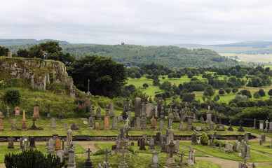 Fototapeta na wymiar Stirling, Scotland - August 1, 2020, old medieval cemetery around Port of Menteith Parish Church.