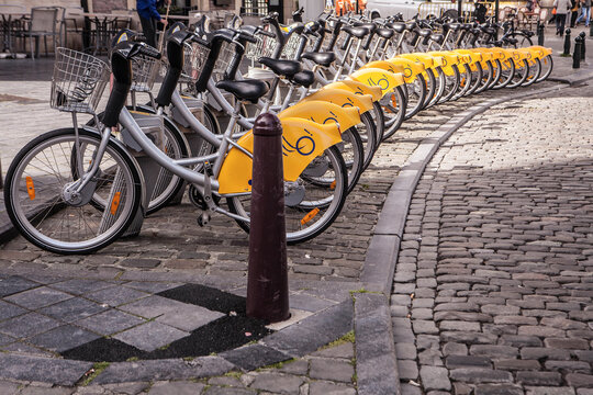 BRUSSELS, BELGIUM -  MAY 19, 2015: Yellow bicycles of self-service Villo for rent in historical center of Brussels