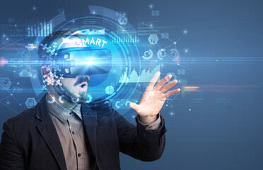 Fototapeta premium Businessman looking through Virtual Reality glasses with SMART inscription, innovative technology concept