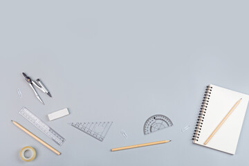 Back to School background with place for text. Collection of school supplies in a bright flat...