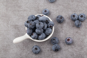 organic superfood blueberry berries on a gray background.