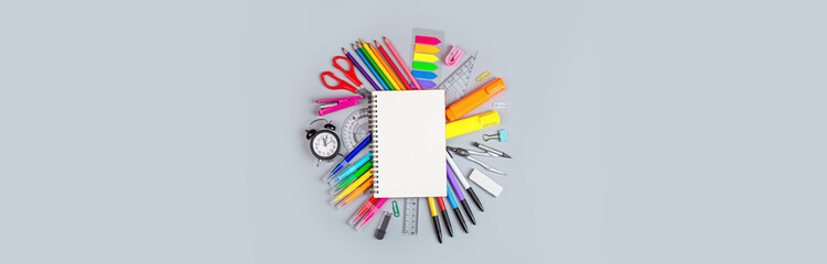Back to School background with place for text. Collection of school supplies in a bright flat style. Educational concept. Copy space, mockup, overhead, template.