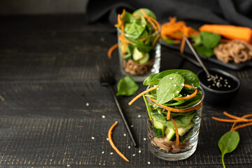 buckwheat noodles with cucumbers, carrots and spinach