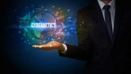 Elegant hand holding CYBERNETICS inscription, digital technology concept