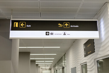 signboard with pointers inside the airport