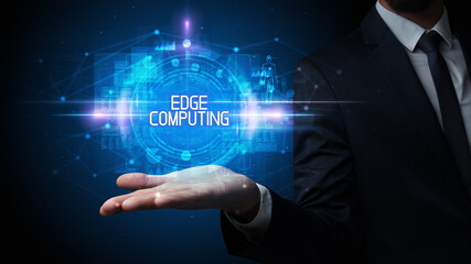 Man hand holding EDGE COMPUTING inscription, technology concept