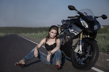 Beautiful woman with a motorcycle