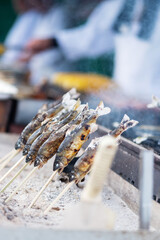 Japanese Fishes grilling, Delicious traditional food in Arashiyama, Kyoto, Japan. Asia travel and Street food concept