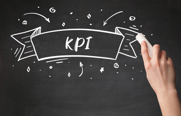 Hand drawing KPI abbreviation with white chalk on blackboard