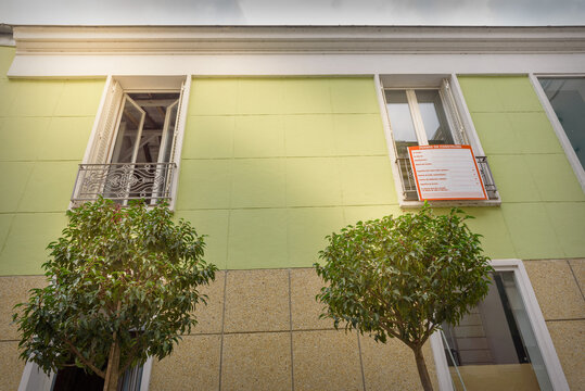 Front side of a little old individual house in a french city on renovation