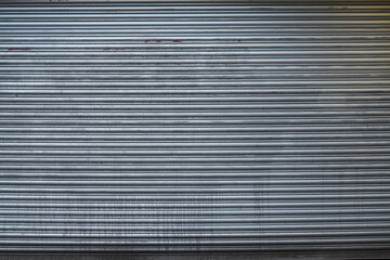 UK, London, Detail of a grey metal doorway garage door, close up, texture.