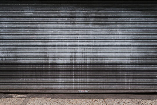 UK, London, Detail Of A Grey Metal Doorway Garage Door, Close Up, Texture.