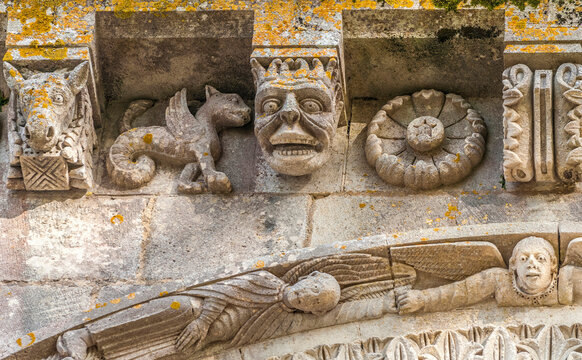 France, Charente Maritime, Surgeres, church of Notre Dame, bas-reliefs and sculpted corbels of the facade
