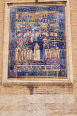 Valencia, Spain - 07/17/2020: A painted ceramic mosaic with a biblical theme in the center of Valencia.