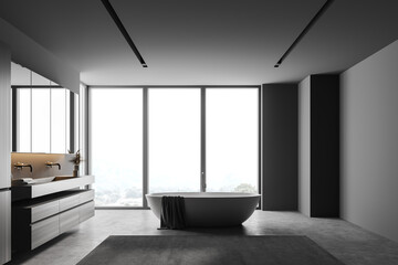 Obraz na płótnie Canvas Grey bathroom with tub and sink, side view