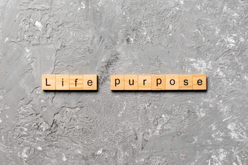 life purpose word written on wood block. life purpose text on cement table for your desing, concept