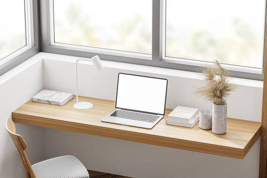 White home office interior with laptop, top view