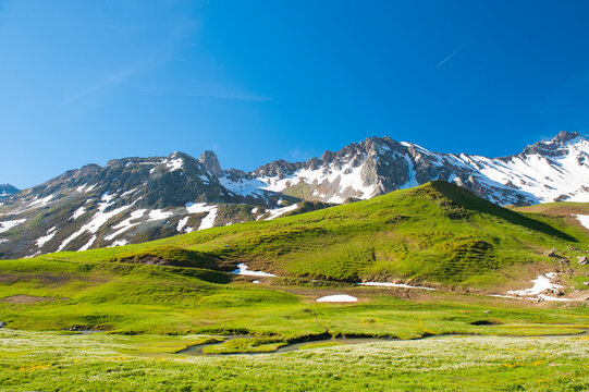 France, Savoie, mountain pastures and glaciers at the col des saisies