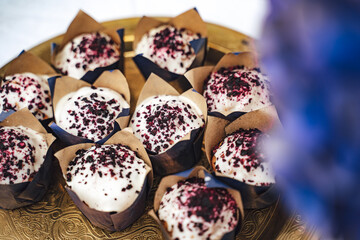 Close up of delicate delicious blueberry muffins served at wedding reception