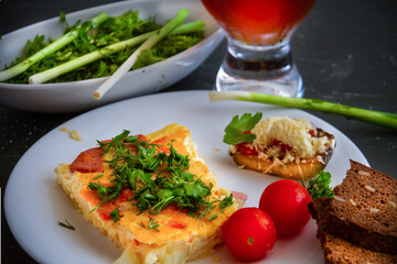 Healthy rustic breakfast. Fritata with herbs, fresh vegetables, bread and bread kvass.