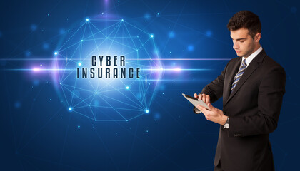 Businessman thinking about security solutions with CYBER INSURANCE inscription