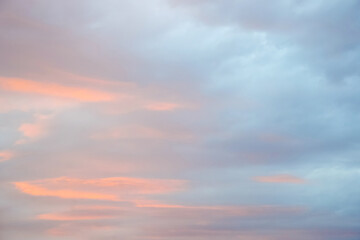 Magic pink-blue sky with clouds at dawn, sunrise and sunset, atmosphere. Beautiful landscape, background. Copy space.
