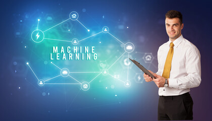 Businessman in front of cloud service icons with MACHINE LEARNING inscription, modern technology concept