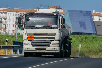 Fototapeta na wymiar Fuel tank truck leaving the city