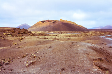 Barren volcanic landscape with El Cuervo (
