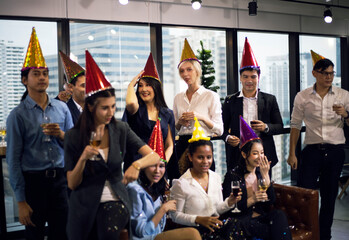 Happiness business persons happy new year party in the offices.