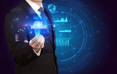 Businessman holding lightbulb with FREE WEBINAR inscription, Business idea concept
