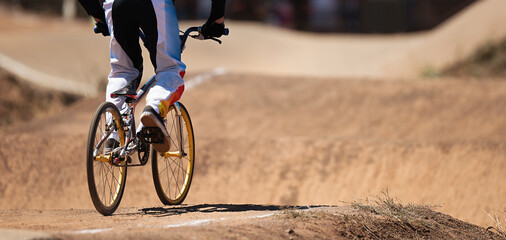 BMX rider competing in the child class on the off-road circuit