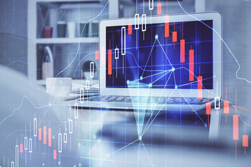 Financial market graph hologram and personal computer on background. Double exposure. Concept of forex.