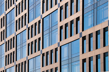 Exterior of modern architecture in the city center. Construction abstract background. Detail of the facade with windows.