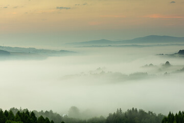 Beautiful Morning at Countryside. Rolling Hills in Morning Fog. Pink Sky. Blue Hour