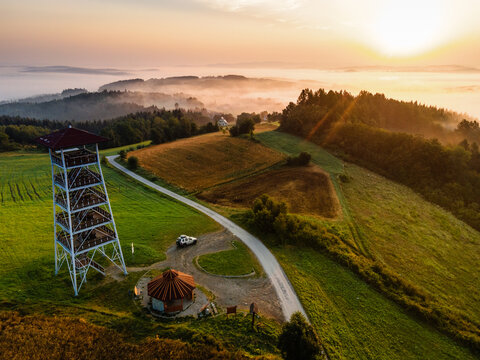 Lookout Tower in Brusnik,Poland and Stunning Countryside at Sunrise in Fog