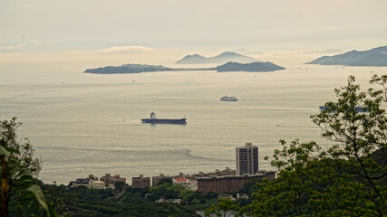 Hong Kong ocean sunset mountain heaven background nautical vessel cargo ship industry