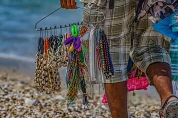 beach vendor selling jewelry on the beach