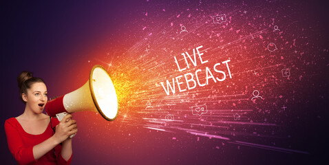Young woman yelling to loudspeaker with LIVE WEBCAST inscription, social networking concept