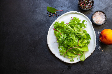 Healthy salad leaves mix salad micro greens, juicy snack. food background keto or paleo diet raw