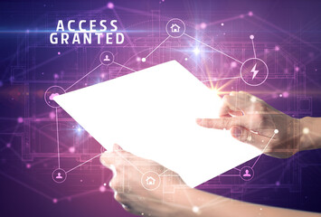 Holding futuristic tablet with ACCESS GRANTED inscription, cyber security concept