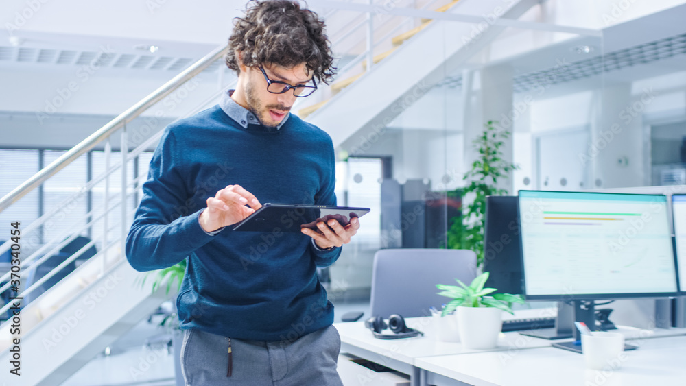 Aufkleber in bright modern office: beautiful office worker walking and using digital tablet computer. young bu