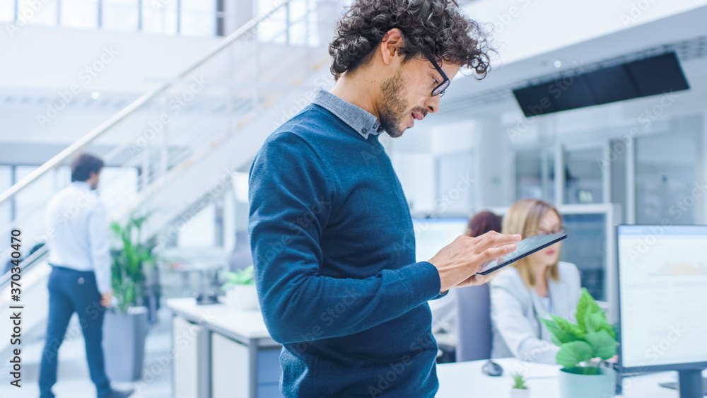 Aufkleber In Bright Modern Office: Beautiful Office Worker is Standing and Using Digital Tablet Computer. Young Businessmen Planning and Solving Problem.