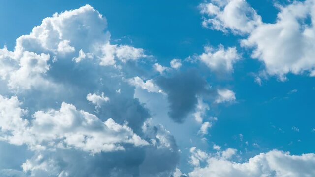 Building motions clouds. Puffy fluffy white clouds sky time lapse. slow moving clouds. B Roll Footage Cloudscape timelapse cloudy. footage timelapse nature 4k. background worship christian concept.
